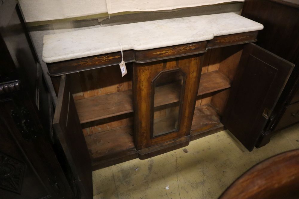 A late Victorian walnut marble top breakfront side cabinet, width 120cm depth 32cm height 84cm